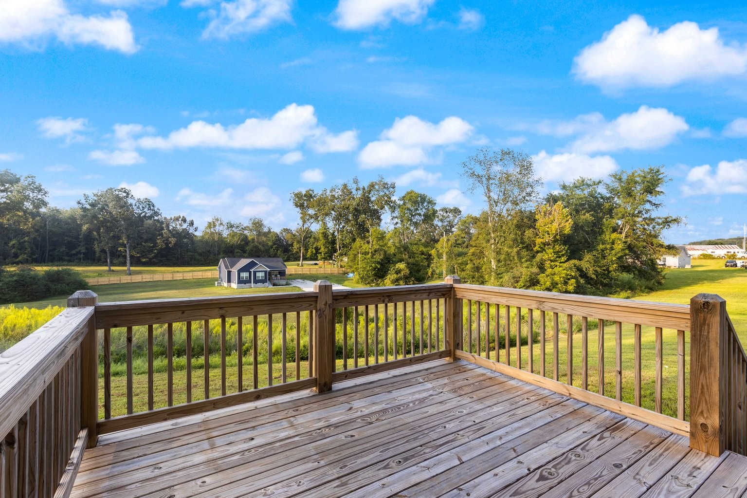 10580 Church Road Bon Aqua, TN 37025 - Photo 25 of 29 a view of a balcony with wooden floor