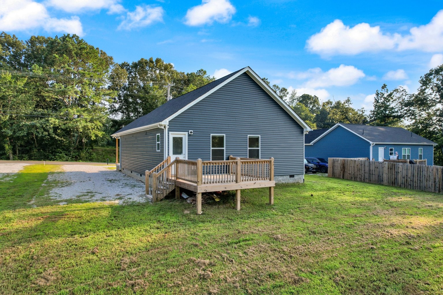 10580 Church Road Bon Aqua, TN 37025 - Photo 28 of 29 a backyard of a house with table and chairs