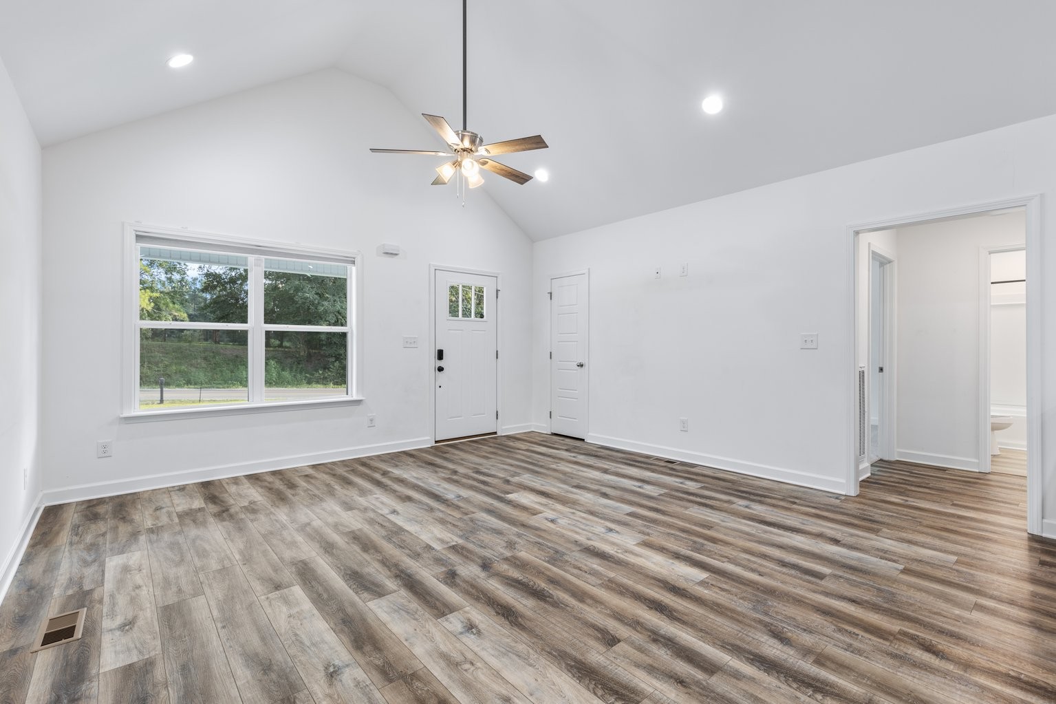 10580 Church Road Bon Aqua, TN 37025 - Photo 6 of 29 a view of empty room with wooden floor and fan