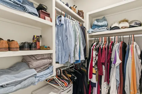 a bathroom with double vanity sink and a mirror