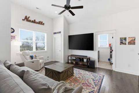 a bedroom with bed and a chandelier