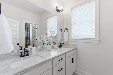 a bathroom with a tub and shower