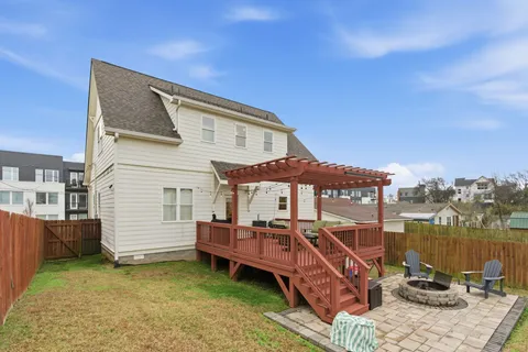 a balcony with furniture and wooden floor