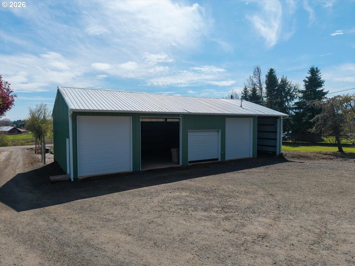 2035 Primrose Loop Philomath, OR 97370 - Photo 17 of 48 a front view of a house with a yard and garage