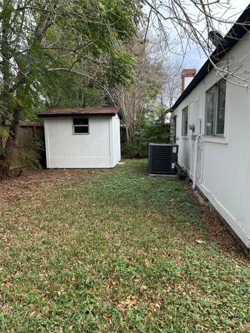 a house with trees in the background