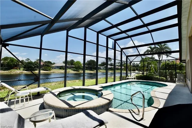 a view of a swimming pool with a patio