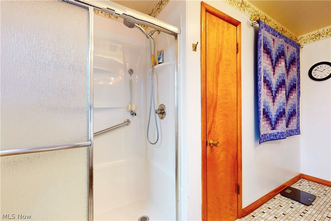 391 Canton Road Steubenville, OH 43953 - Photo 24 of 40 Full bathroom featuring a shower stall and tile patterned flooring