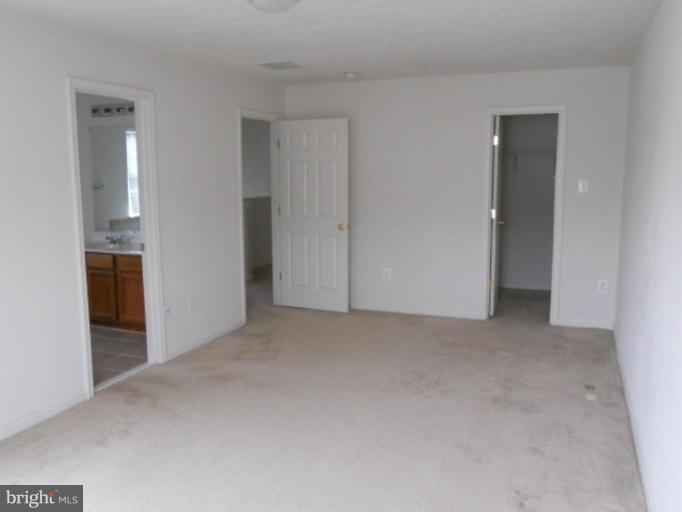 801 Tipton Road Middle River, MD 21220 - Photo 3 of 9 a view of an empty room and closet