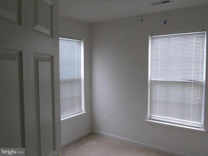 801 Tipton Road Middle River, MD 21220 - Photo 5 of 9 a view of an empty room with a window