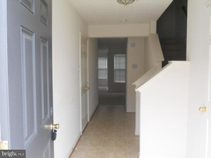 801 Tipton Road Middle River, MD 21220 - Photo 7 of 9 a view of a hallway with a white cabinet