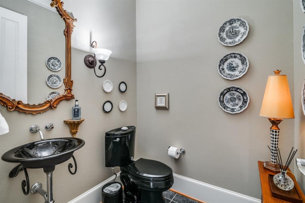 8 Griffith Court Terrell, TX 75160 - Photo 12 of 25 Half bath with toilet and baseboards