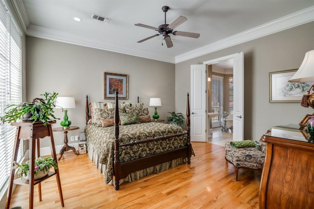 8 Griffith Court Terrell, TX 75160 - Photo 13 of 25 Primary Bedroom with crown molding, light hardwood flooring, ceiling fan, sitting area, and ensuite