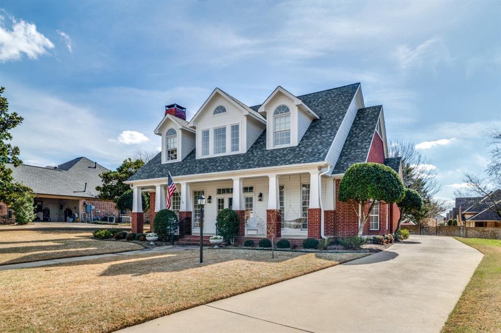 8 Griffith Court Terrell, TX 75160 - Photo 2 of 25 View of front facade with a porch, brick siding, a front lawn, and concrete driveway