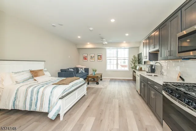 a large room with a bed and a large window