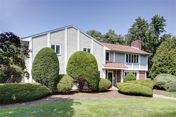 15 Goffe Road Lexington, MA 02421 - Photo 1 of 10 a front view of a house with a garden