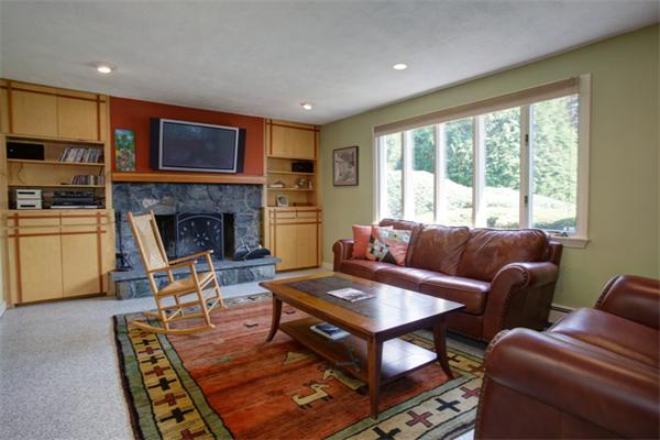 15 Goffe Road Lexington, MA 02421 - Photo 5 of 10 a living room with furniture a fireplace and a flat screen tv
