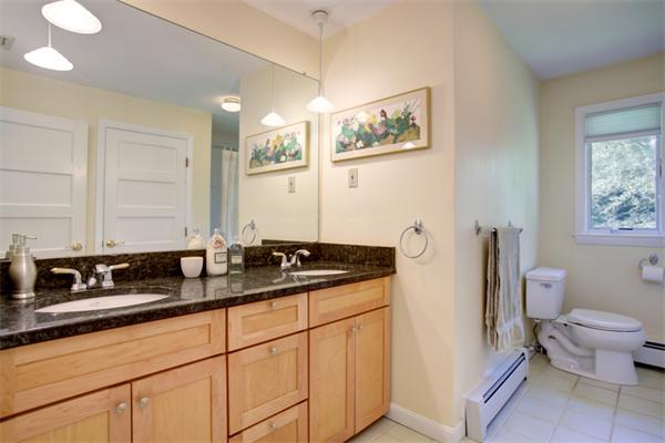 15 Goffe Road Lexington, MA 02421 - Photo 8 of 10 a bathroom with a granite countertop sink and a mirror