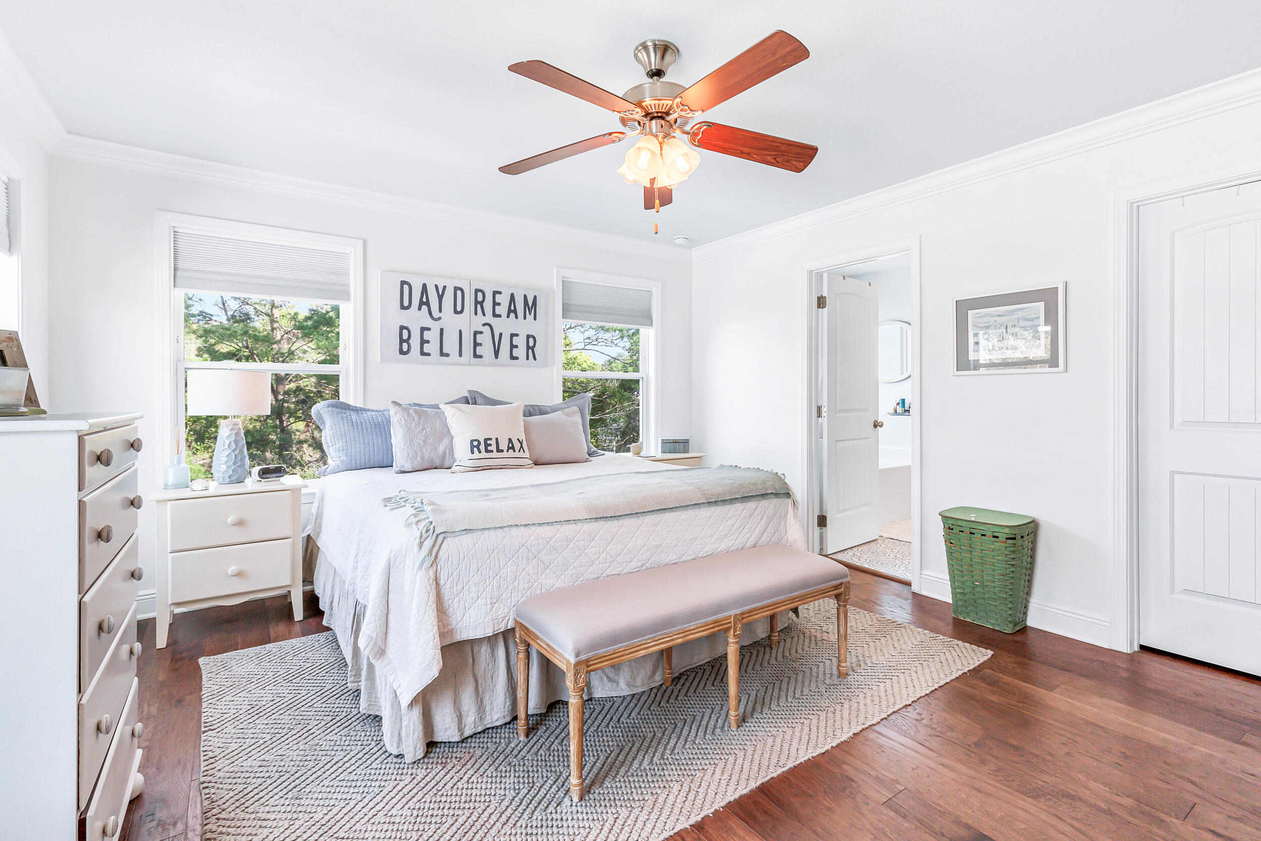 136 Grayling Way Inlet Beach, FL 32461 - Photo 13 of 22 a bedroom with a bed and a table in it with wooden floor