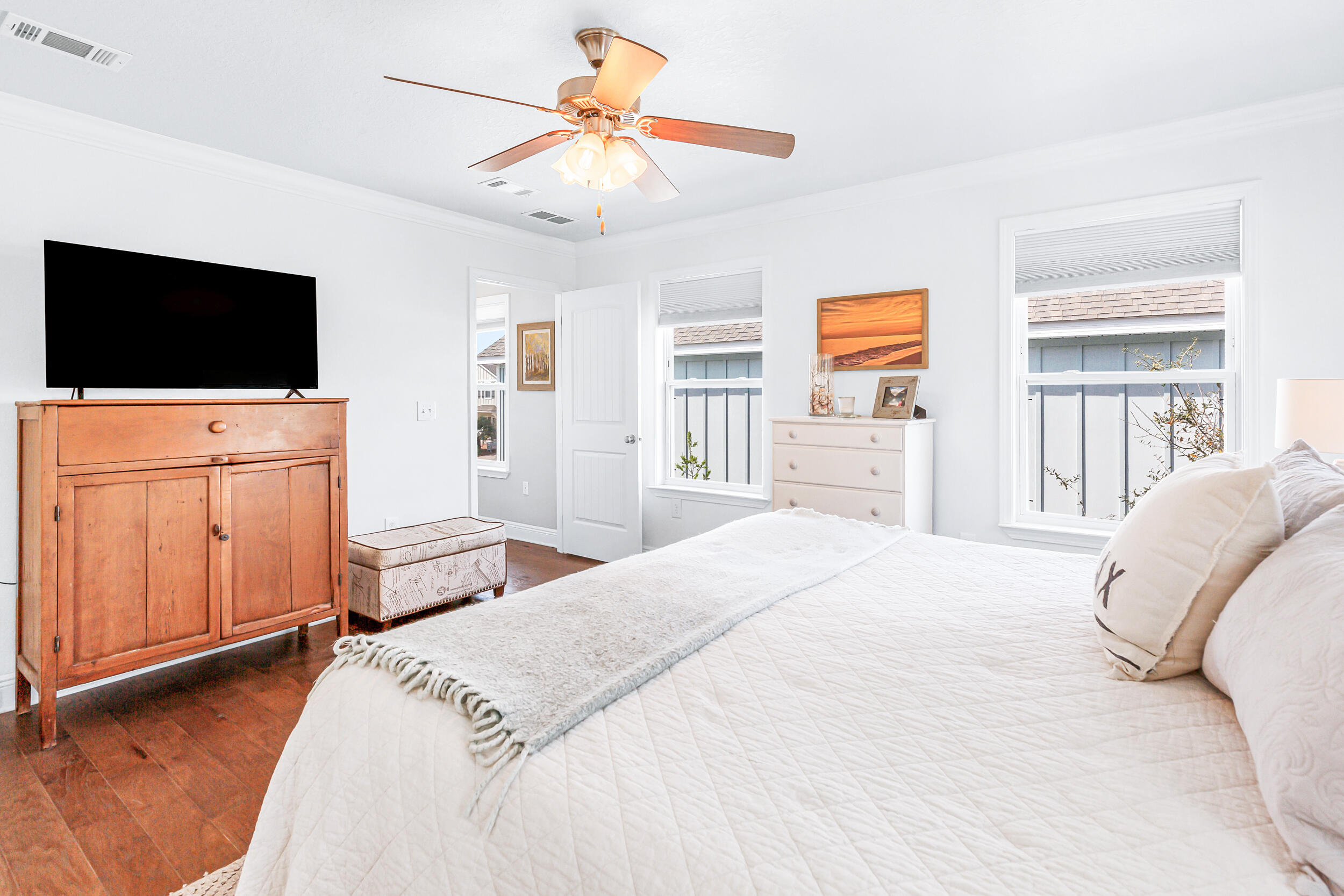 136 Grayling Way Inlet Beach, FL 32461 - Photo 14 of 22 a spacious bedroom with a bed and a flat screen tv