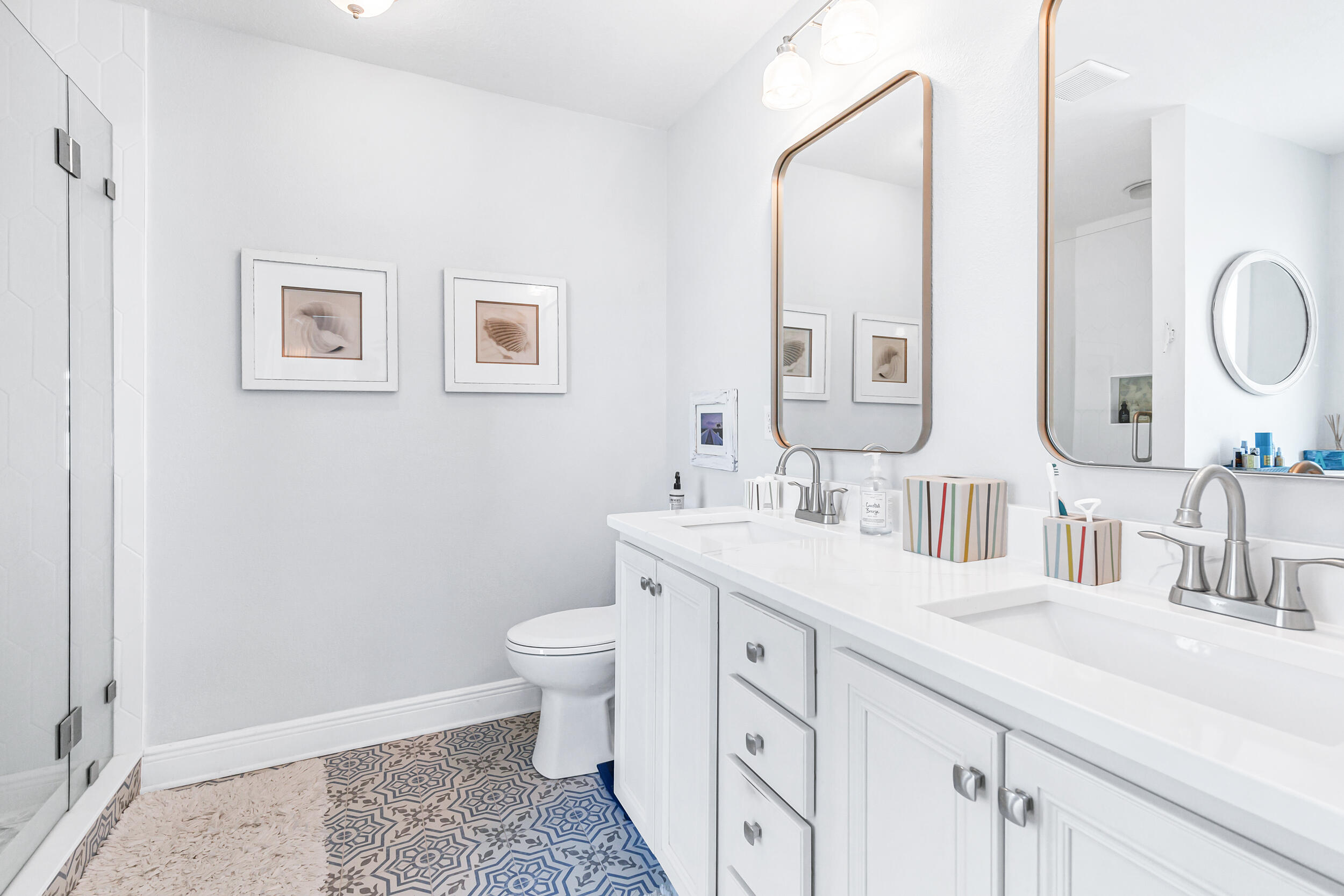 136 Grayling Way Inlet Beach, FL 32461 - Photo 16 of 22 a bathroom with double vanity sink a mirror and a toilet