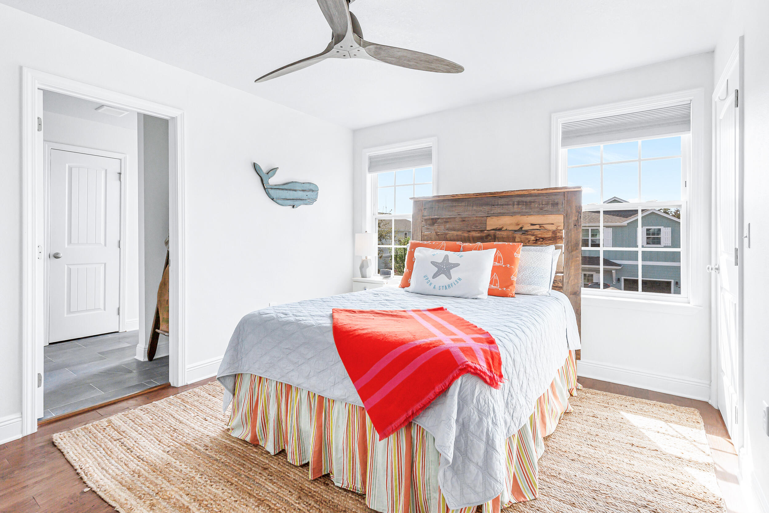 136 Grayling Way Inlet Beach, FL 32461 - Photo 17 of 22 a bedroom with a bed and wooden floor