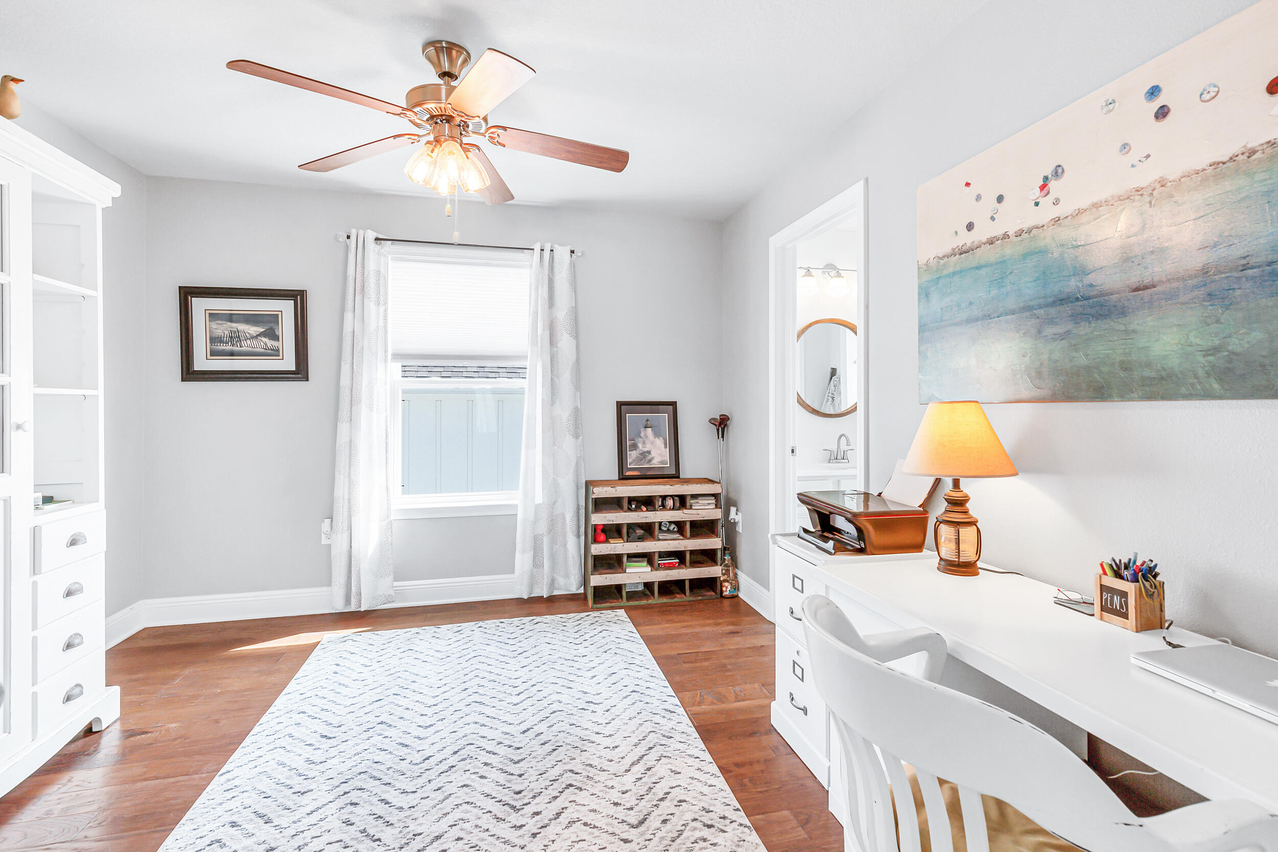 136 Grayling Way Inlet Beach, FL 32461 - Photo 18 of 22 a bedroom with a bed and wooden floor