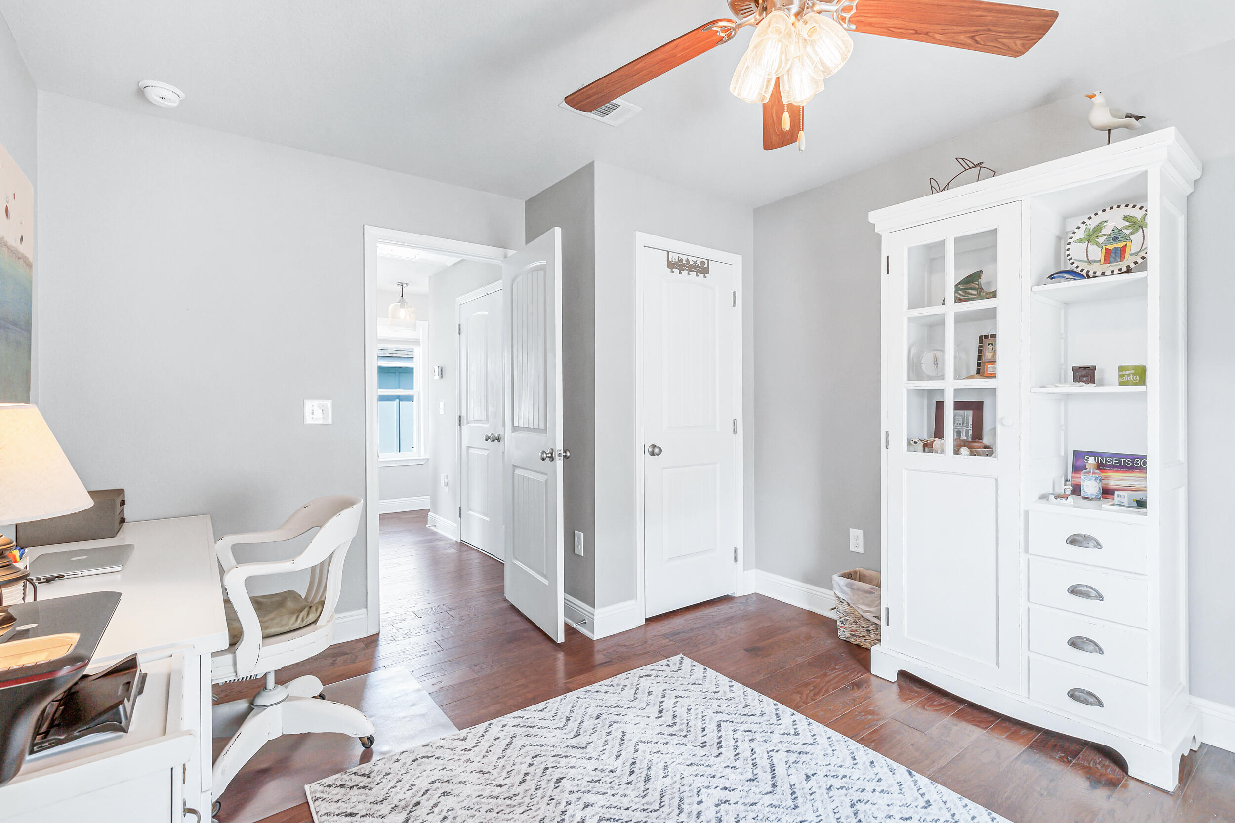 136 Grayling Way Inlet Beach, FL 32461 - Photo 19 of 22 a view of a hallway with white walls and wooden floor