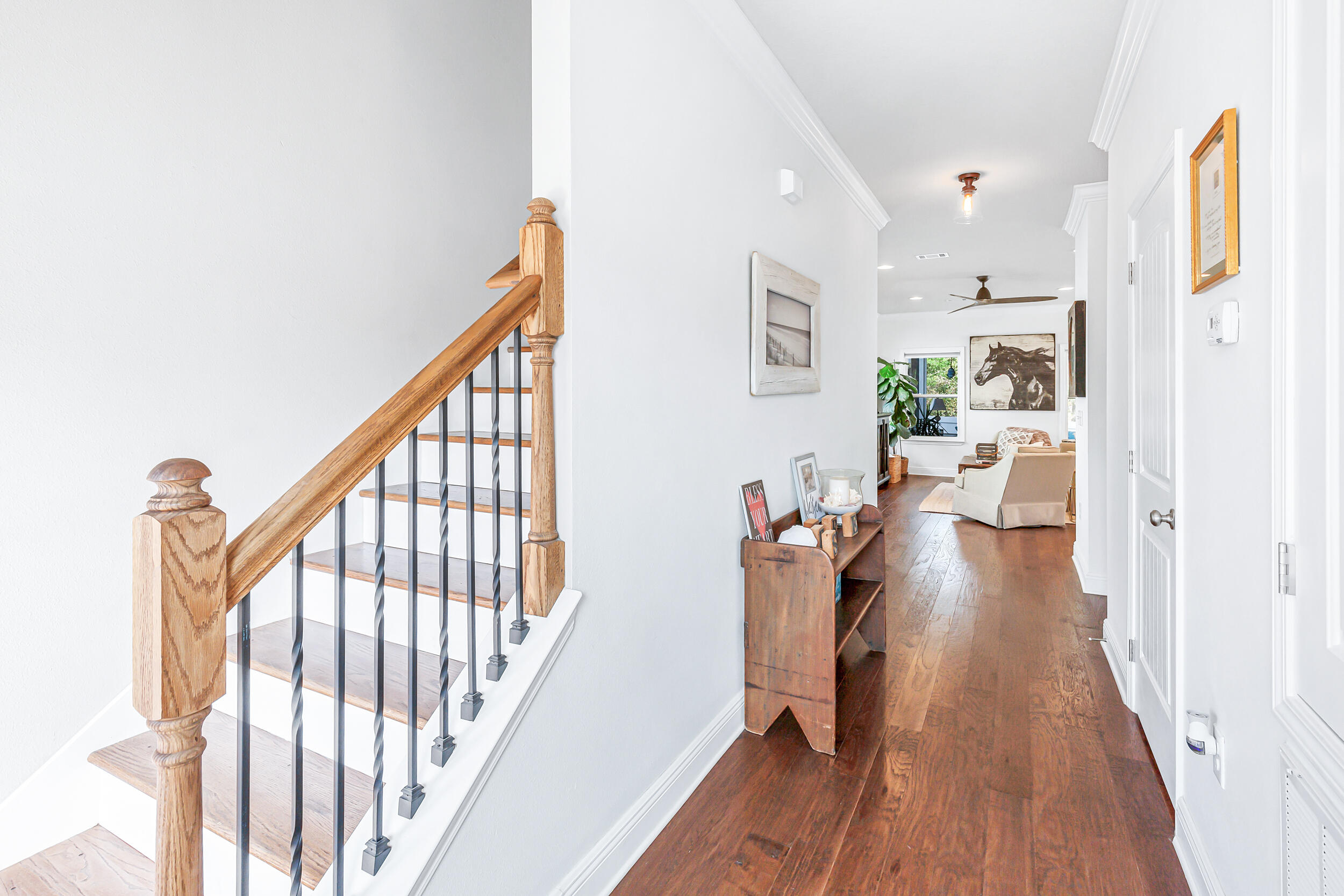 136 Grayling Way Inlet Beach, FL 32461 - Photo 2 of 22 a view of a hallway with wooden floor fireplace and living room