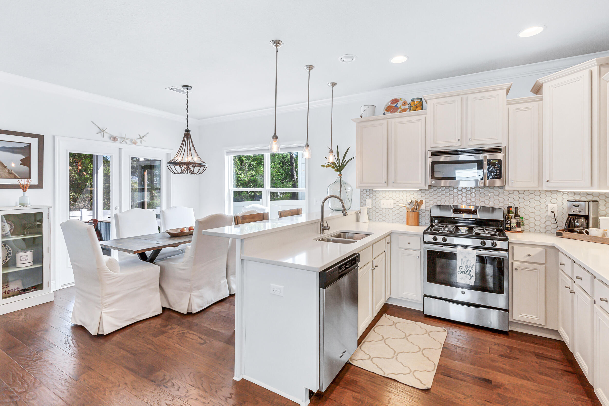 136 Grayling Way Inlet Beach, FL 32461 - Photo 5 of 22 a kitchen with stainless steel appliances granite countertop a stove oven and a view of living room