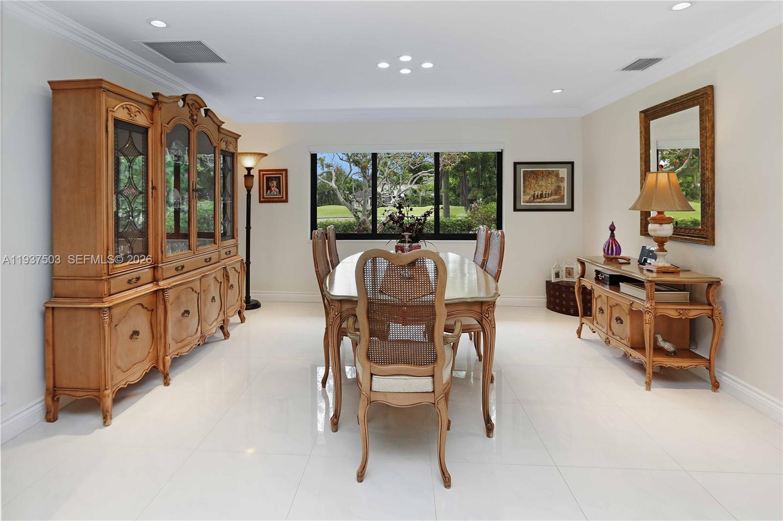 3650 North 36th Avenue, Unit 2 Hollywood, FL 33021 - Photo 11 of 52 a dining room with furniture and window