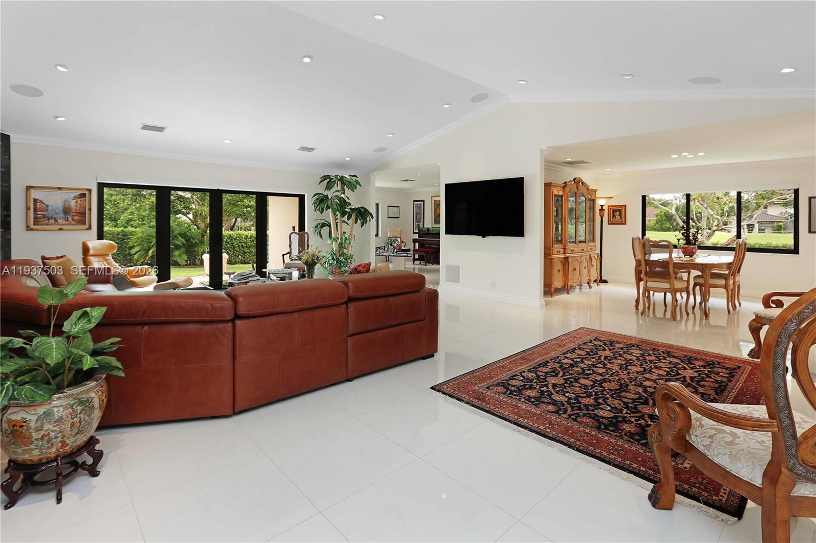 3650 North 36th Avenue, Unit 2 Hollywood, FL 33021 - Photo 18 of 52 a living room with furniture and a flat screen tv