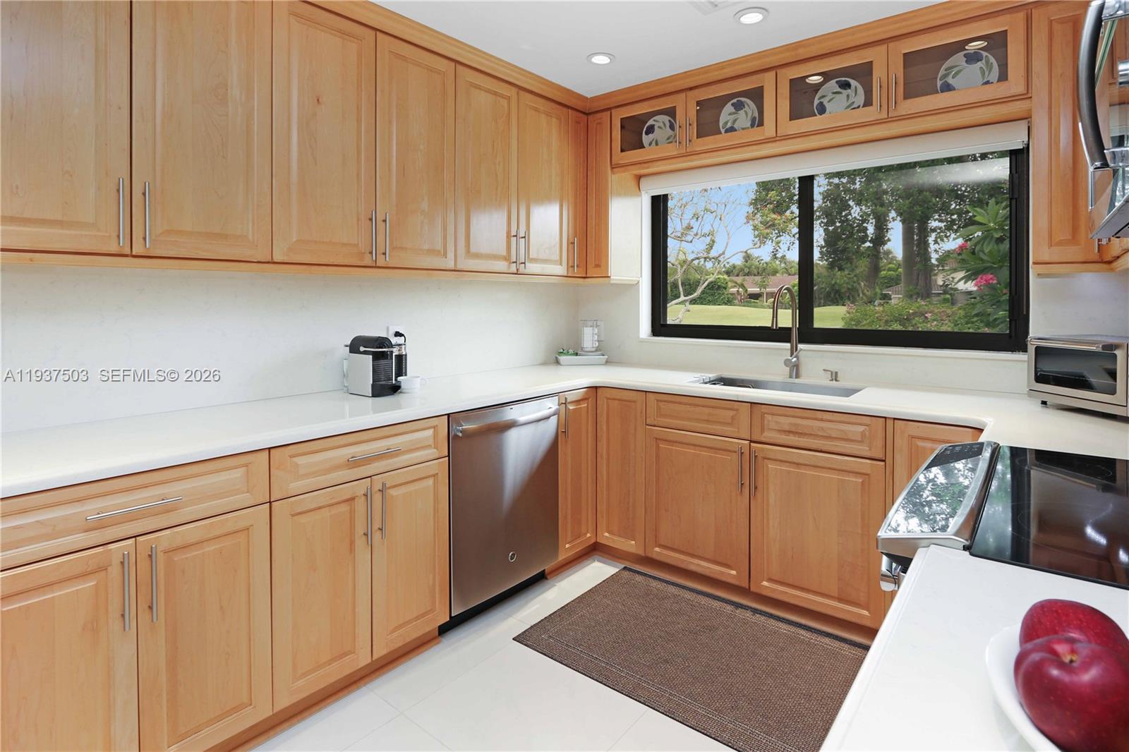3650 North 36th Avenue, Unit 2 Hollywood, FL 33021 - Photo 28 of 52 a kitchen with stainless steel appliances granite countertop a sink and a stove top oven
