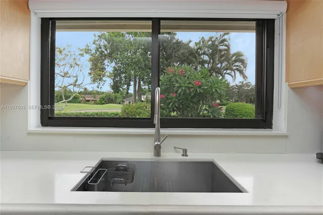 a kitchen with stainless steel appliances a refrigerator and stove