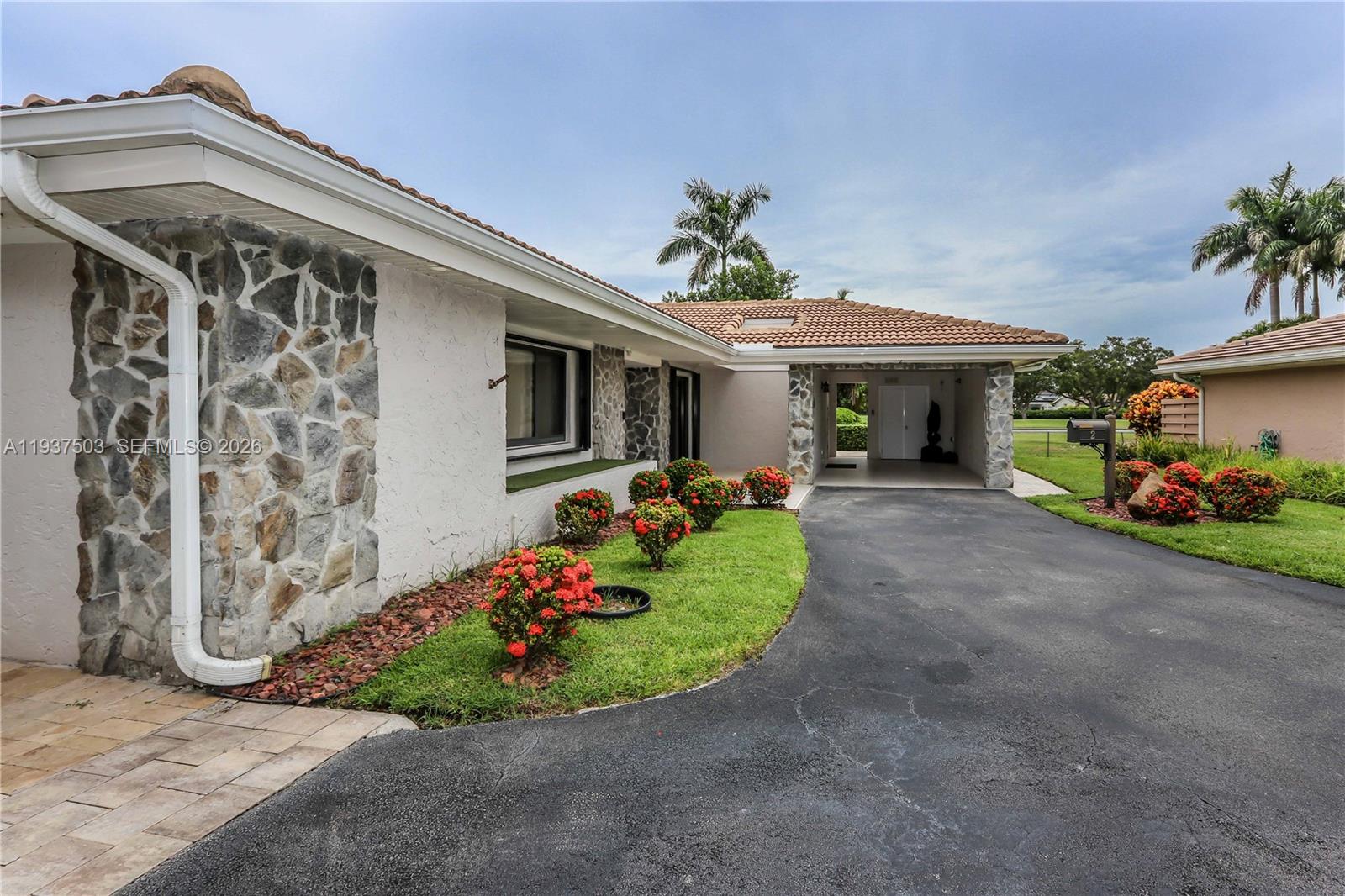 3650 North 36th Avenue, Unit 2 Hollywood, FL 33021 - Photo 3 of 52 a front view of a house with garden