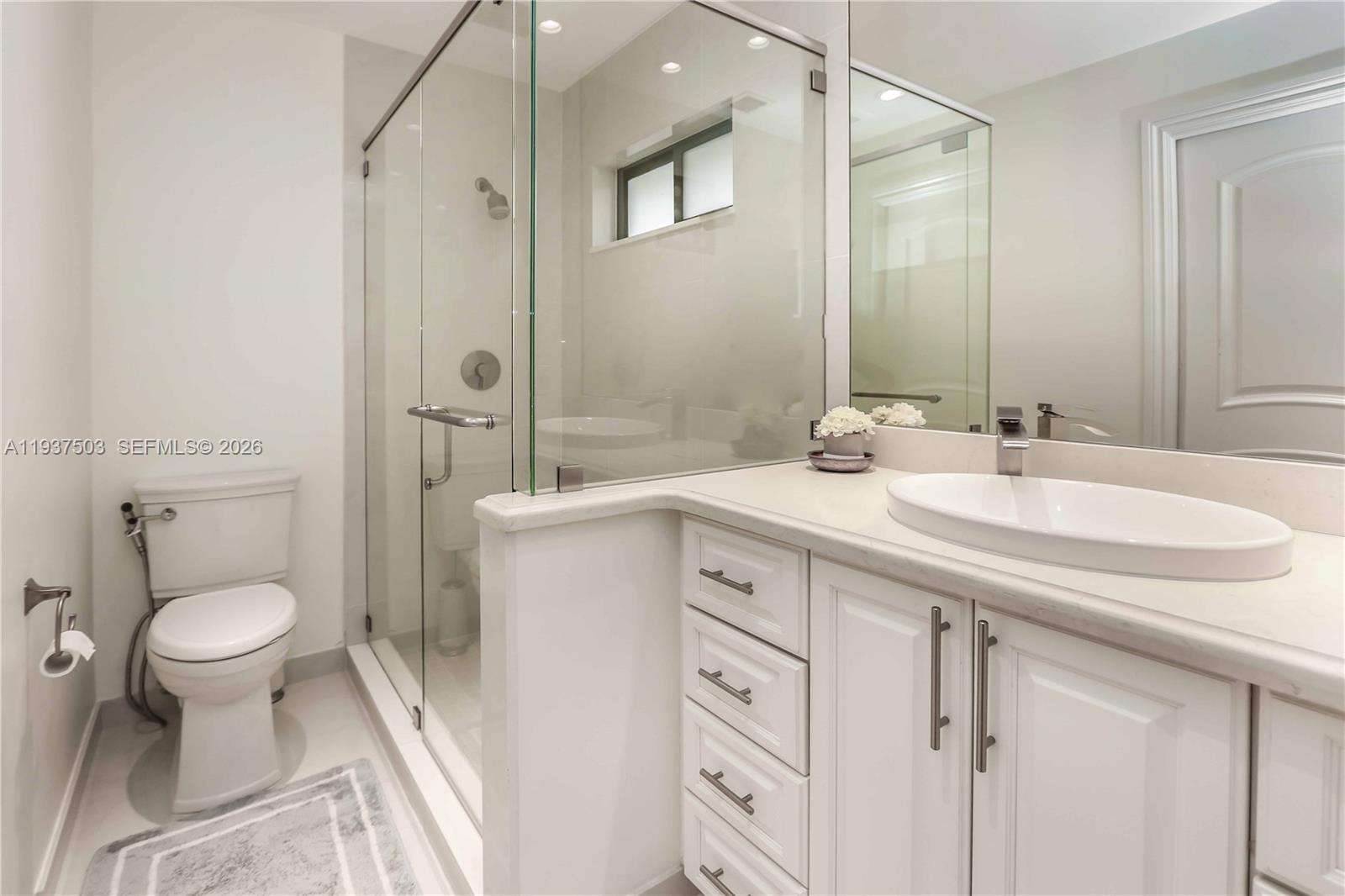 3650 North 36th Avenue, Unit 2 Hollywood, FL 33021 - Photo 33 of 52 a bathroom with a sink toilet and shower