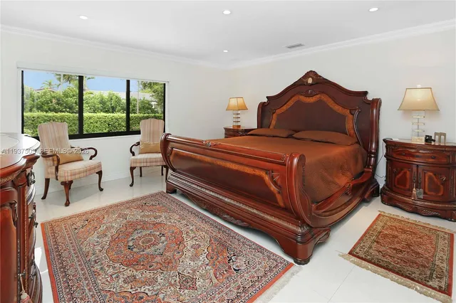 a bedroom with a bed and lamp