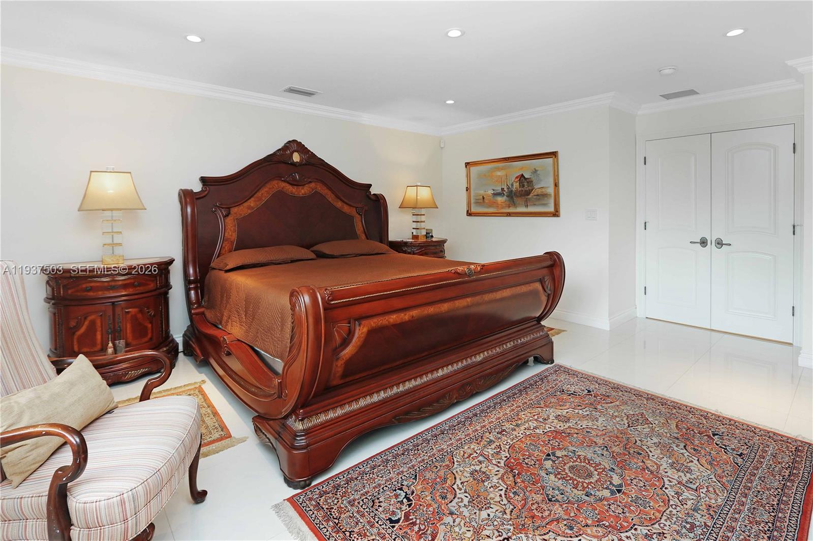 3650 North 36th Avenue, Unit 2 Hollywood, FL 33021 - Photo 35 of 52 a bedroom with a bed and lamp