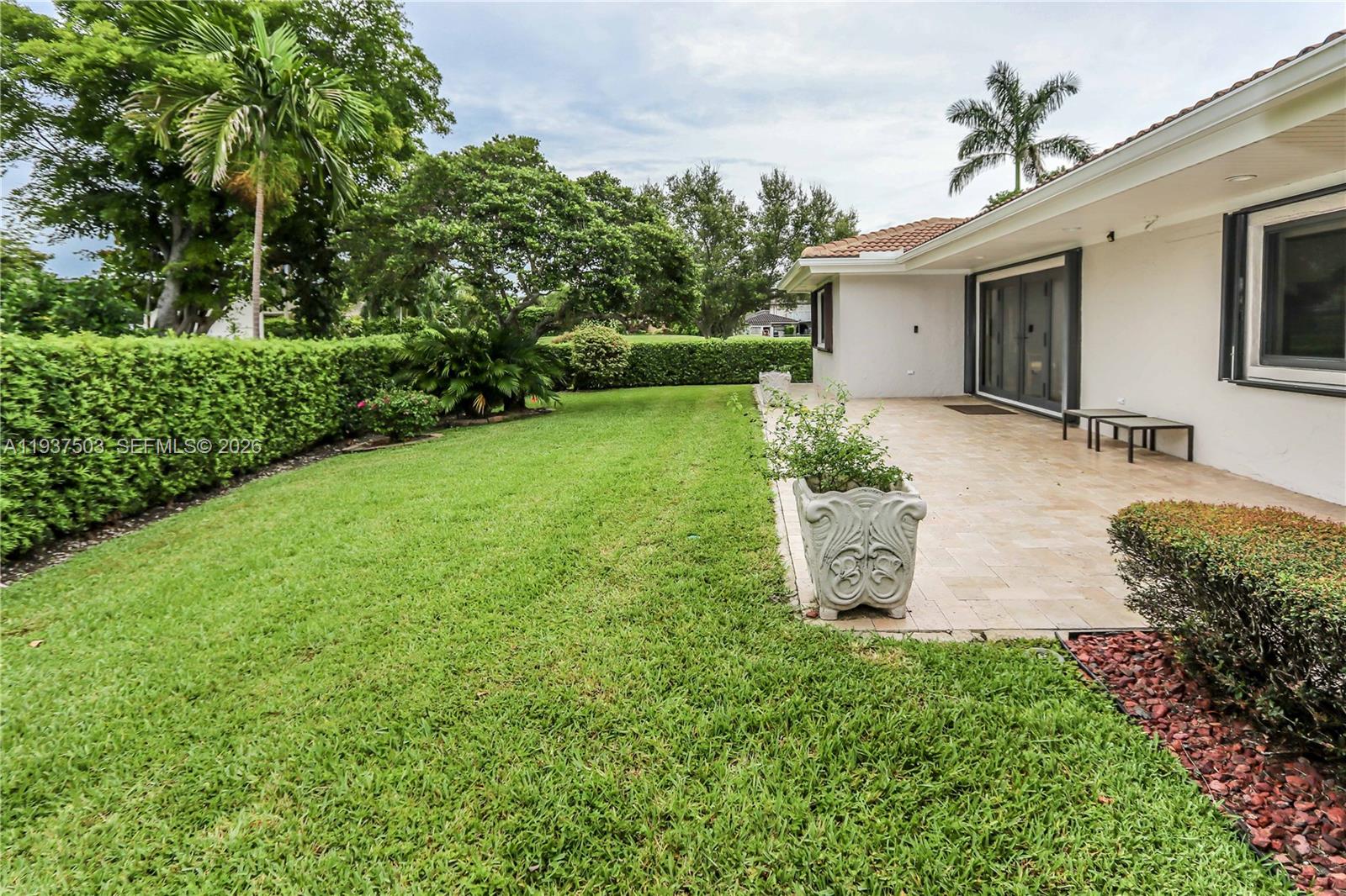 3650 North 36th Avenue, Unit 2 Hollywood, FL 33021 - Photo 41 of 52 a view of a house with backyard and garden