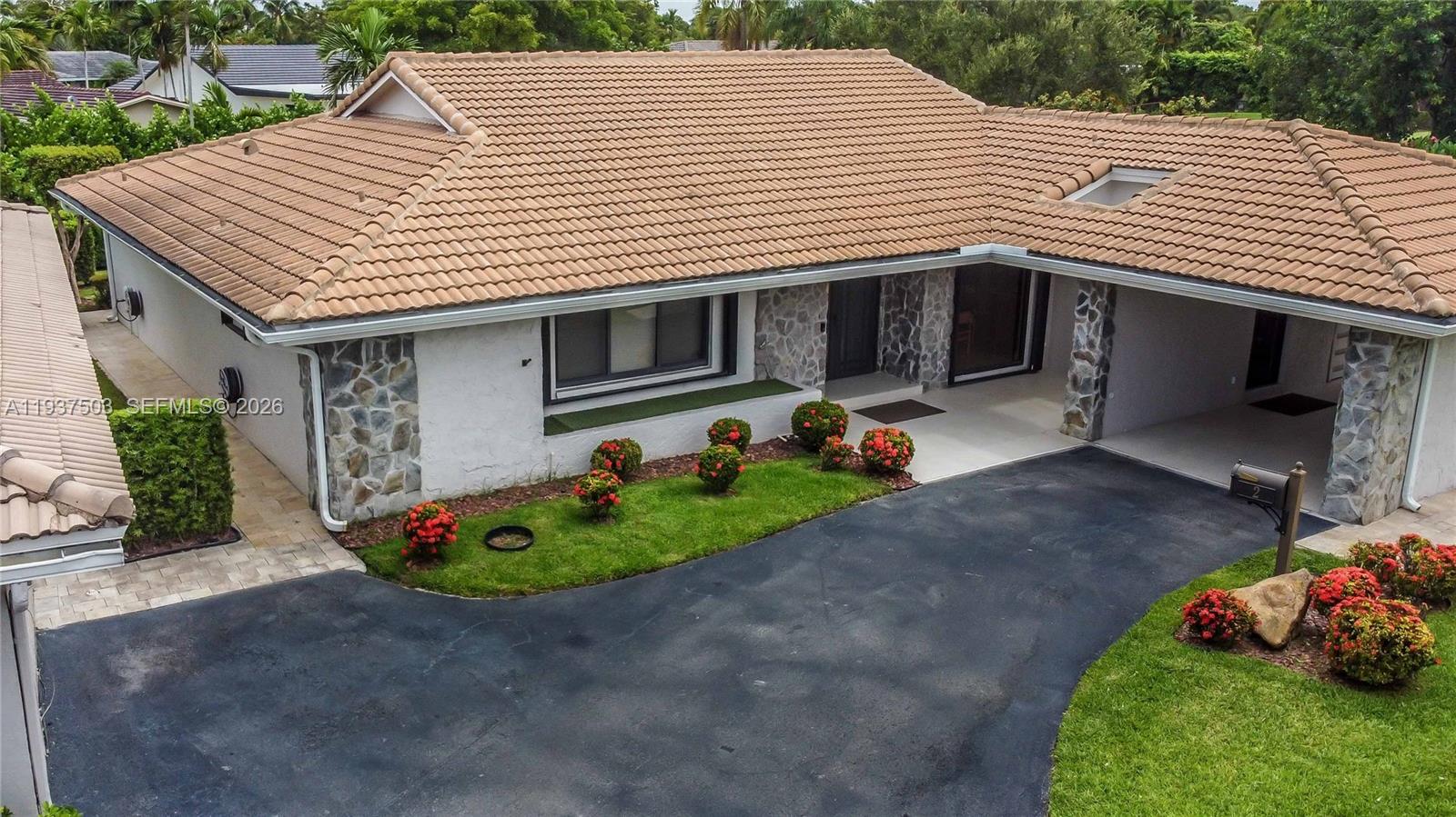3650 North 36th Avenue, Unit 2 Hollywood, FL 33021 - Photo 52 of 52 a front view of a house with a garden