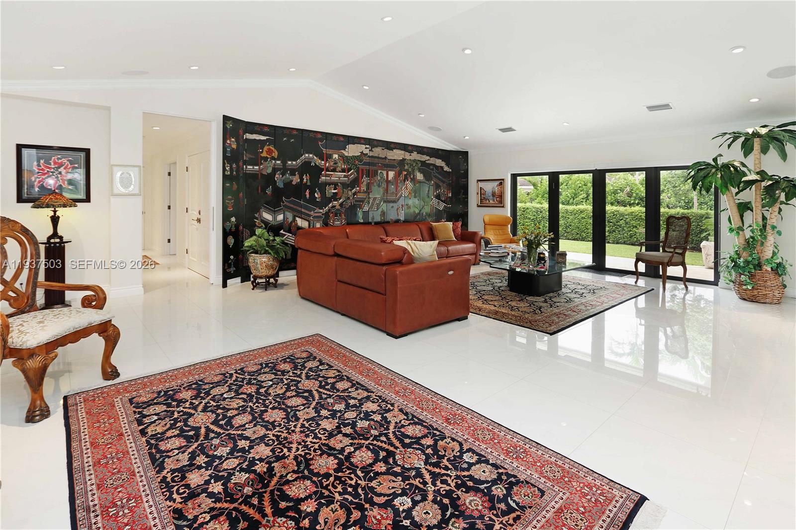 3650 North 36th Avenue, Unit 2 Hollywood, FL 33021 - Photo 8 of 52 a living room with furniture and a flat screen tv