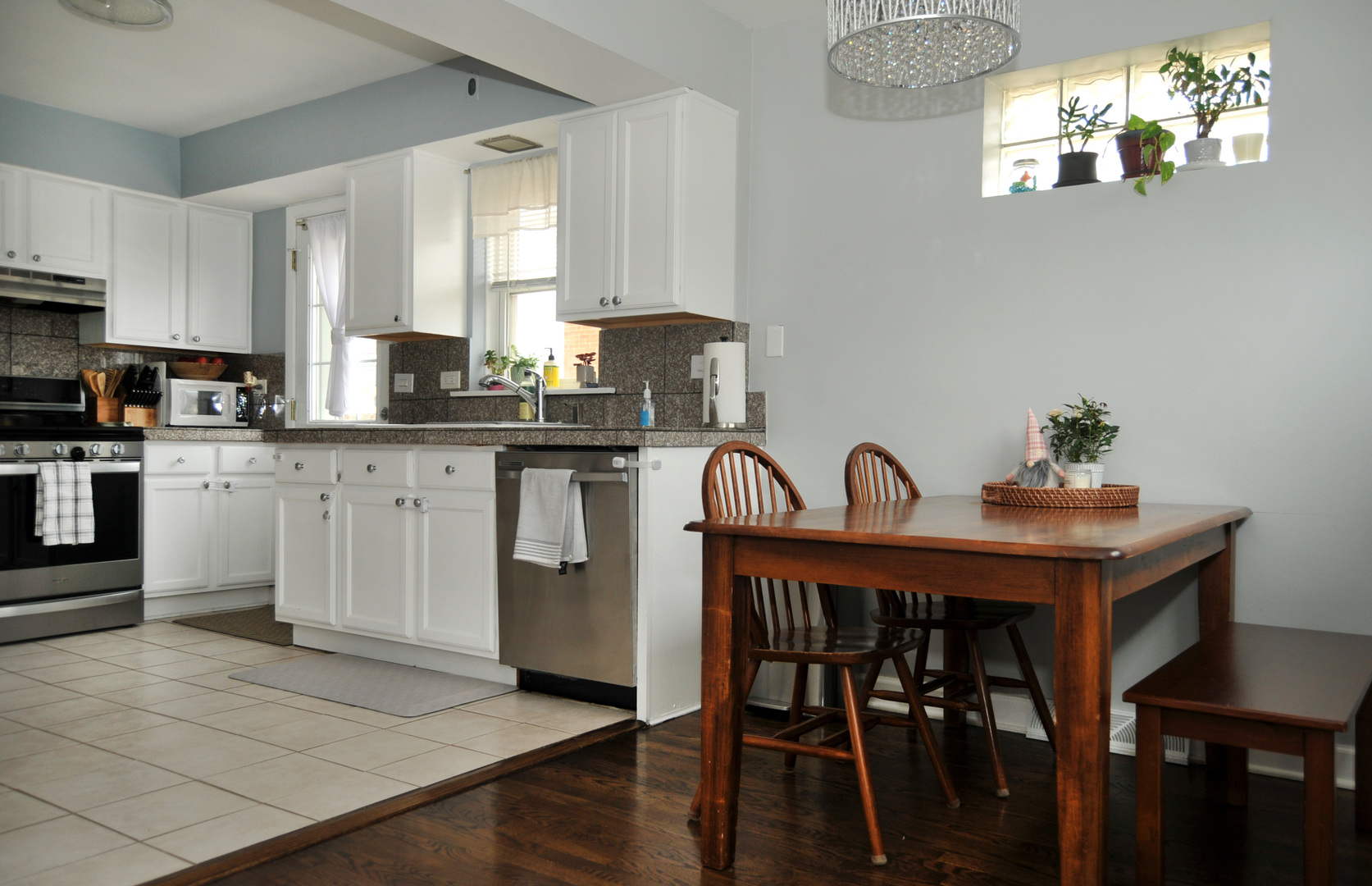 4417 Arthur Avenue Brookfield, IL 60513 - Photo 6 of 19 a kitchen with cabinets table and chairs