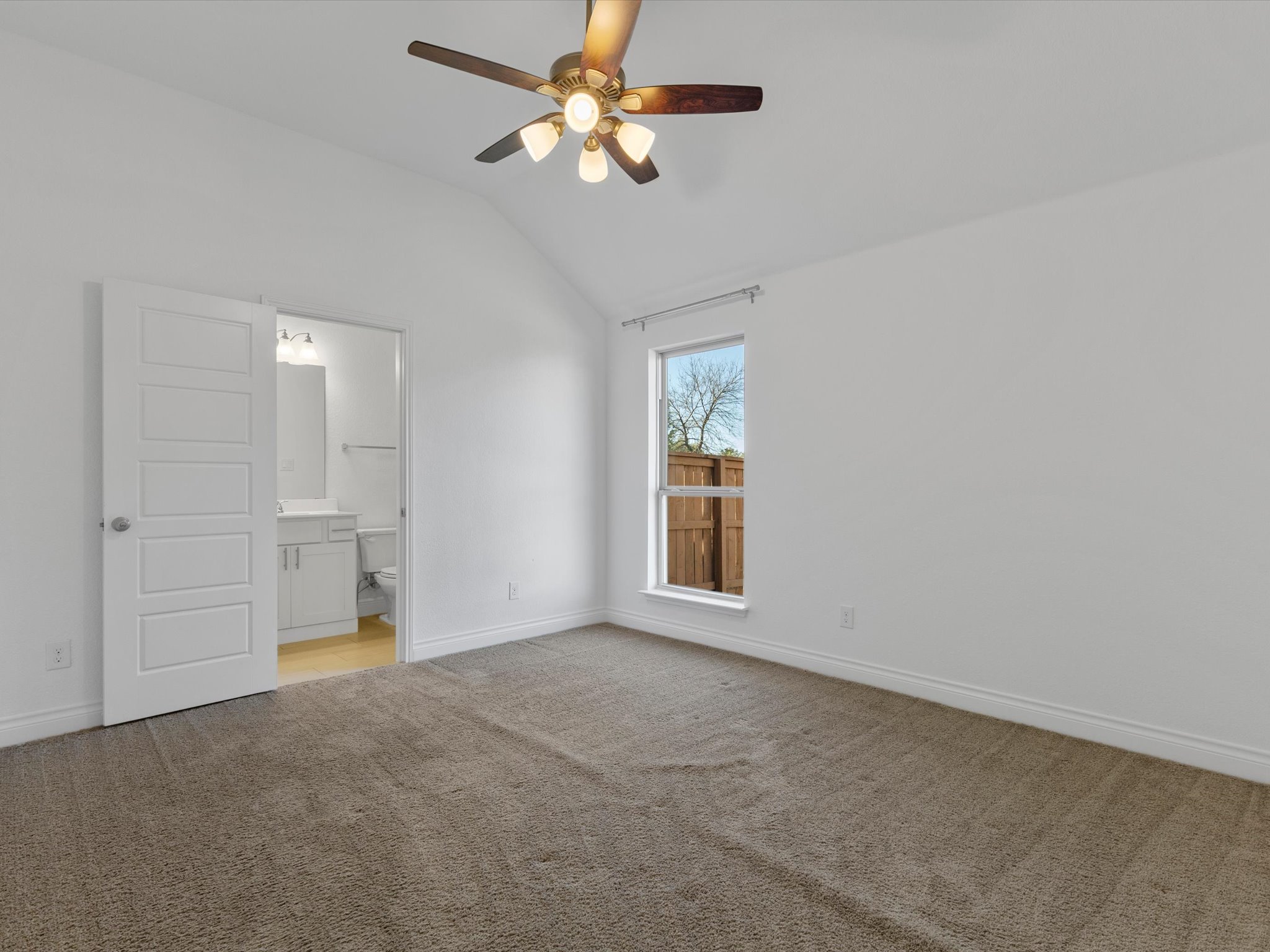 1009 Deer Rim Road Leander, TX 78641 - Photo 21 of 40 On one side of the entry hallway you will find this large secondary bedroom with a walk-in closet and its own ensuite bathroom.