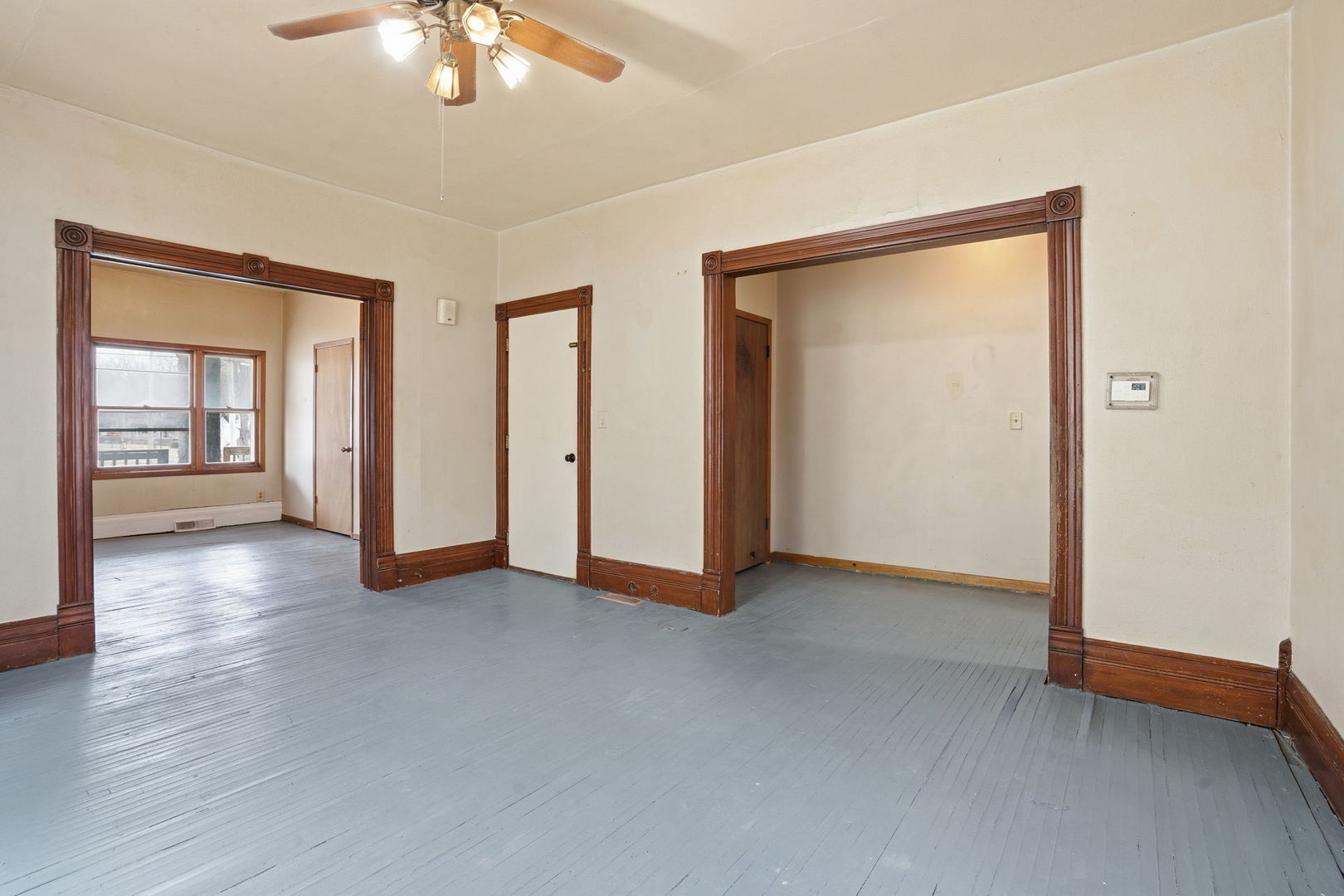903 44th Street Rock Island, IL 61201 - Photo 4 of 28 an empty room with chandelier fan and windows