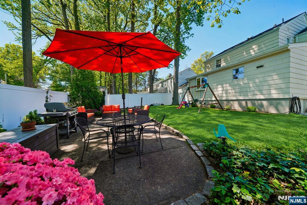 99 Ferncliff Road Bloomfield, NJ 07003 - Photo 26 of 30 an outdoor space with furniture and umbrella