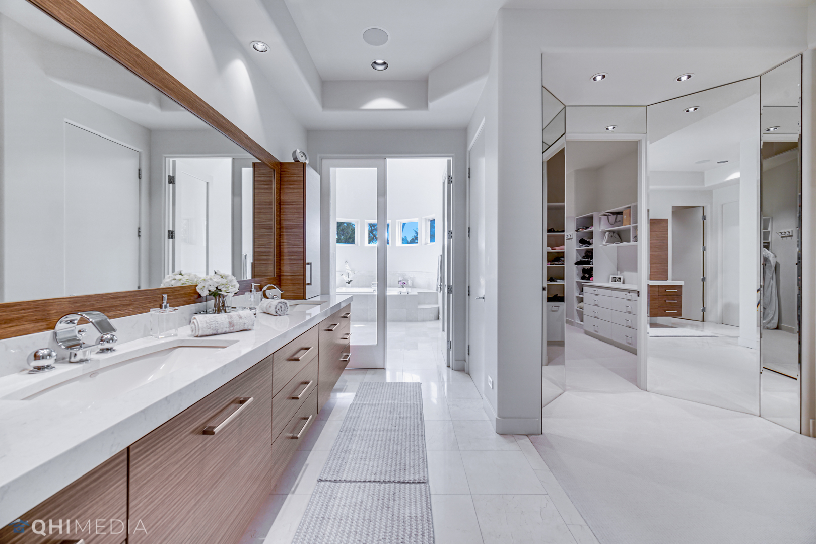 2225 Greenview Road Northbrook, IL 60062 - Photo 30 of 68 a large bathroom with a double vanity sink a large mirror and a shower