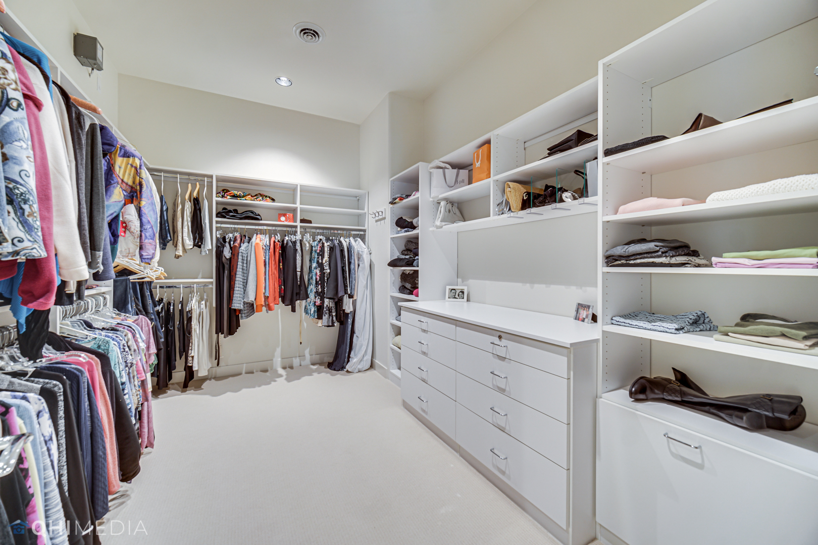 2225 Greenview Road Northbrook, IL 60062 - Photo 34 of 68 a view of walk in closet with clothes and shoes