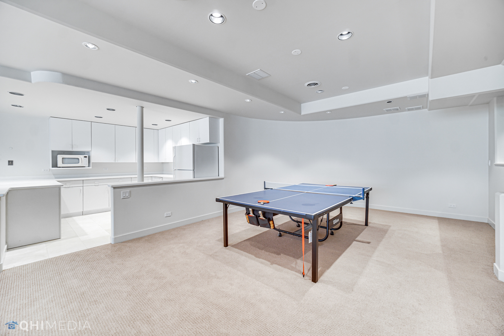 2225 Greenview Road Northbrook, IL 60062 - Photo 42 of 68 a living room with stainless steel appliances kitchen island a table and cabinets
