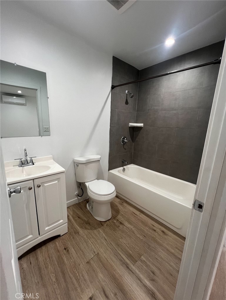 1207 East 23rd Street, Unit 1/2 Los Angeles, CA 90011 - Photo 8 of 8 a bathroom with a sink a toilet and shower