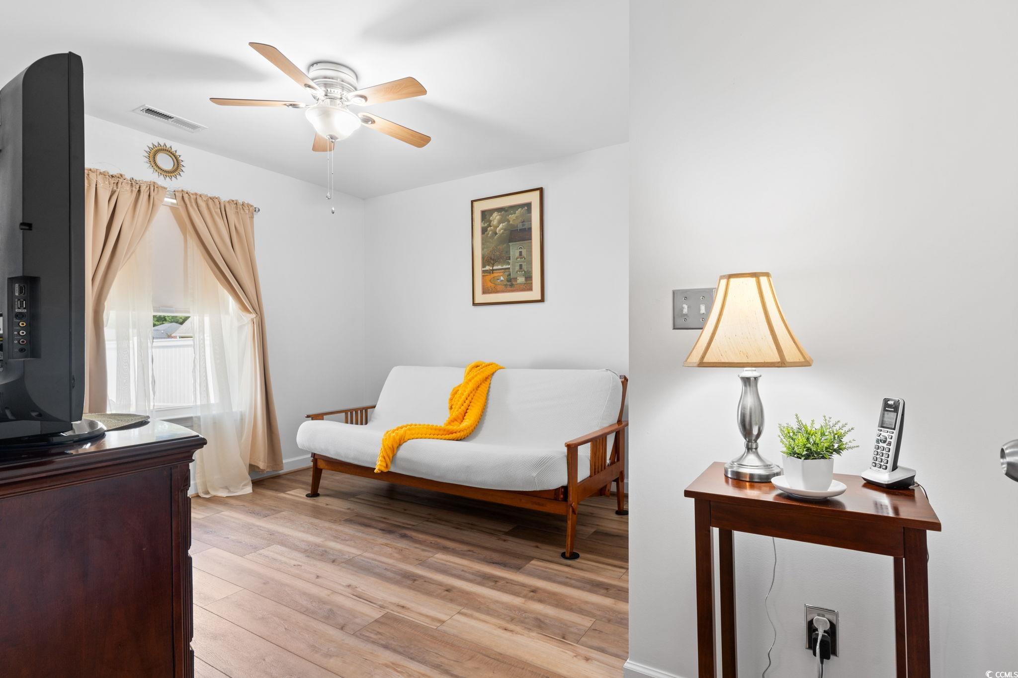 2209 Belladora Road Conway, SC 29527 - Photo 21 of 40 Sitting room with a ceiling fan and light wood-sty