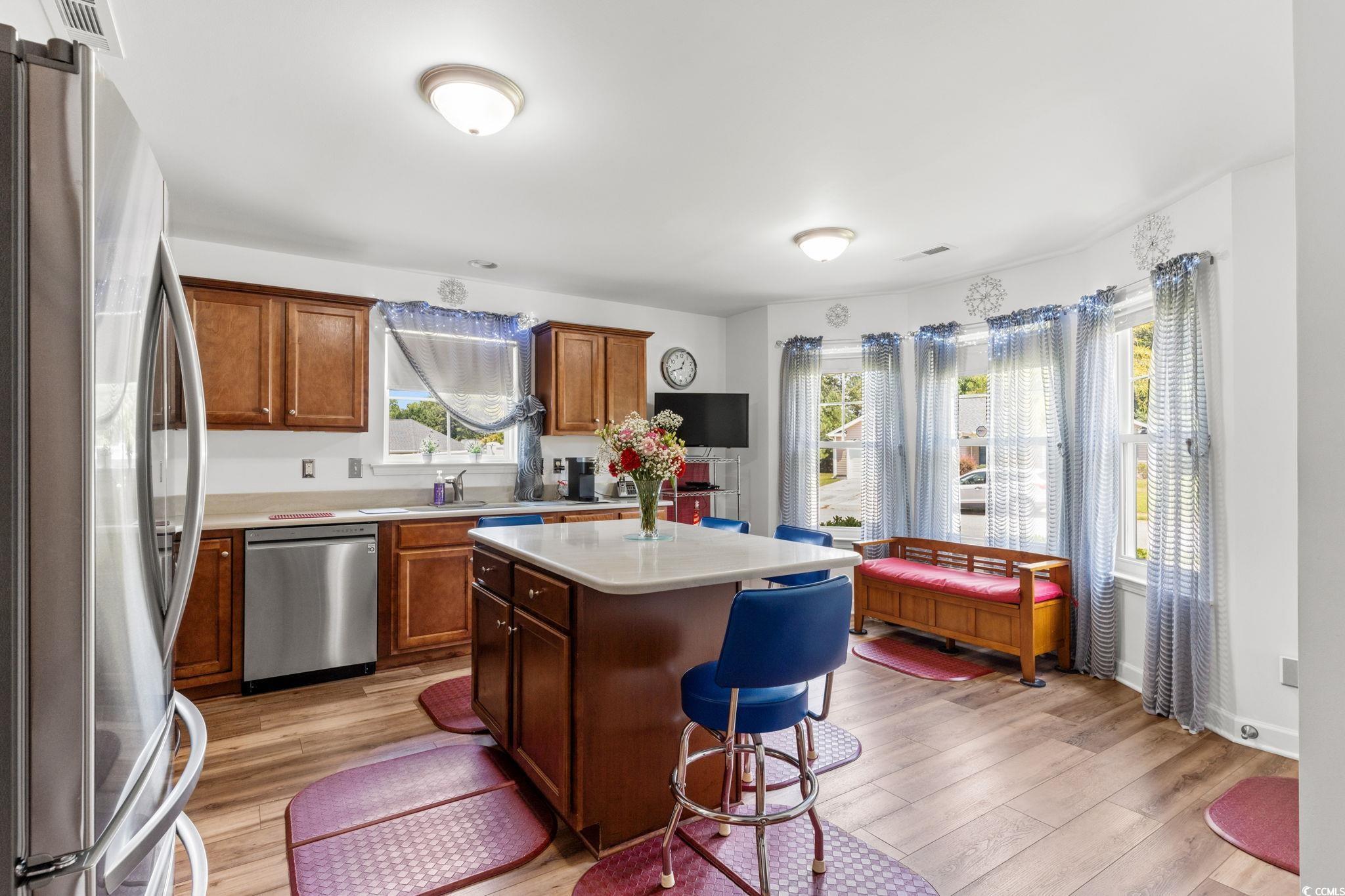 2209 Belladora Road Conway, SC 29527 - Photo 7 of 40 Kitchen with stainless steel appliances, light woo